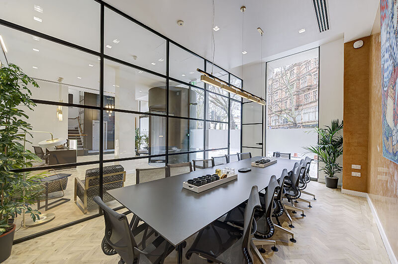 Modern boardroom interior representing the Textplode sale to MBA Group
